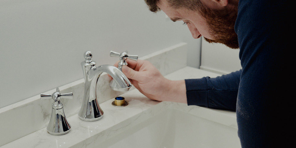 jeremy-fixing-faucet-bathroom